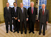 Group portrait of five presidential men in dark suits and ties