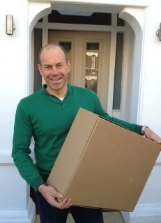 Phil Spencer holding a box