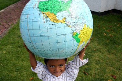 Child holding a globe