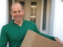 Phil Spencer holding a box