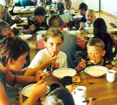 Children eating lunch at SOS Summer Camp in Karkle, Lithuania