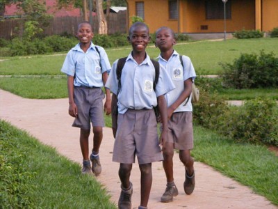 Boys coming home from school, Gulu, Uganda